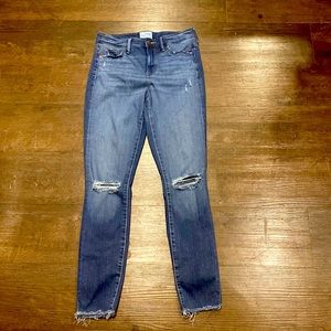 High rise, skinny ankle jeans with ripped hem